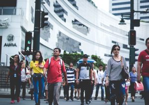 people walking down a busy street; must engage in bayanihan during the coronavirus pandemic